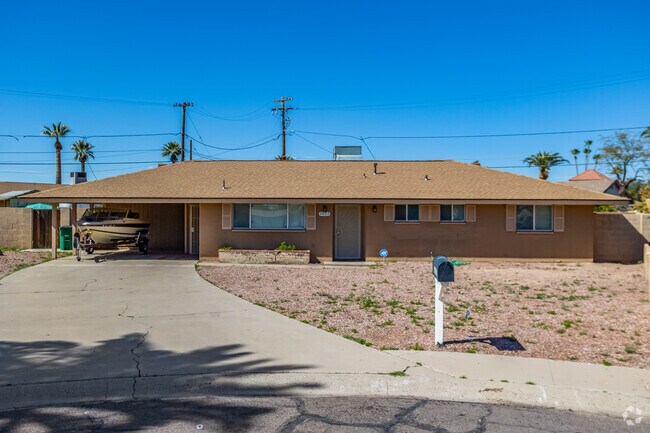 A single-family home in Historic Goodyear with an open garage.