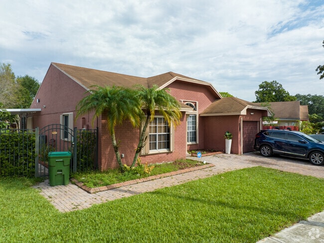 Traditional red brick home with an attached garage in Lakeside South.