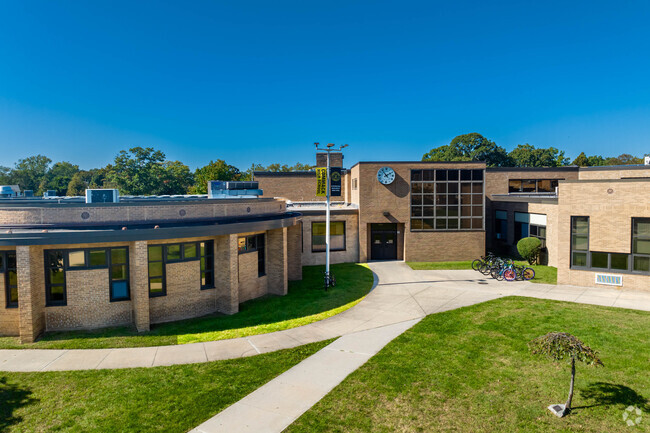 Many students at Commack High School ride their bikes to school.
