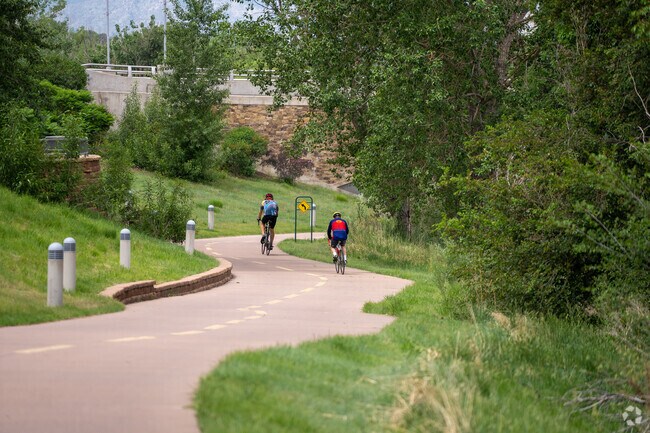 Bikers on Mary Carter Greenway trail in the Sheridan neighborhood.