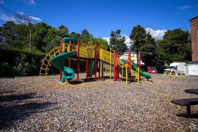 Children's laughter can be heard during recess at the Greenleaf Academy playground area.