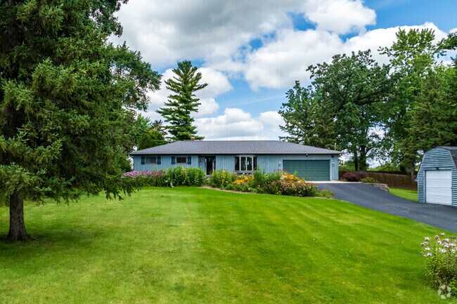 A modest ranch-style home sits on a large lot in Butte Des Morts.