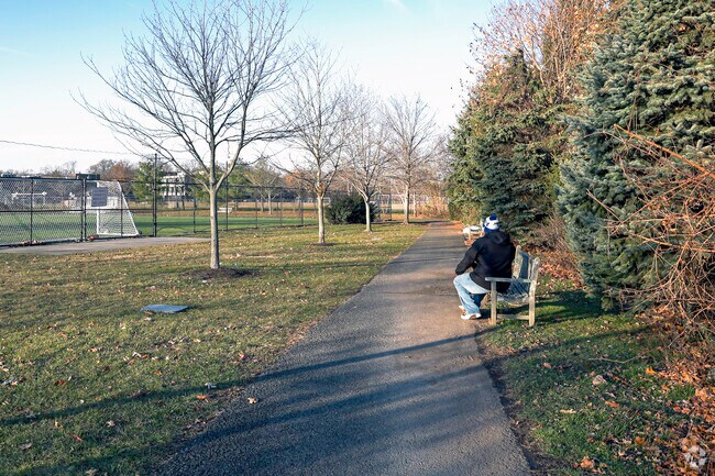 Enjoying a seat in the park on a beautiful day in the Larchmont community.