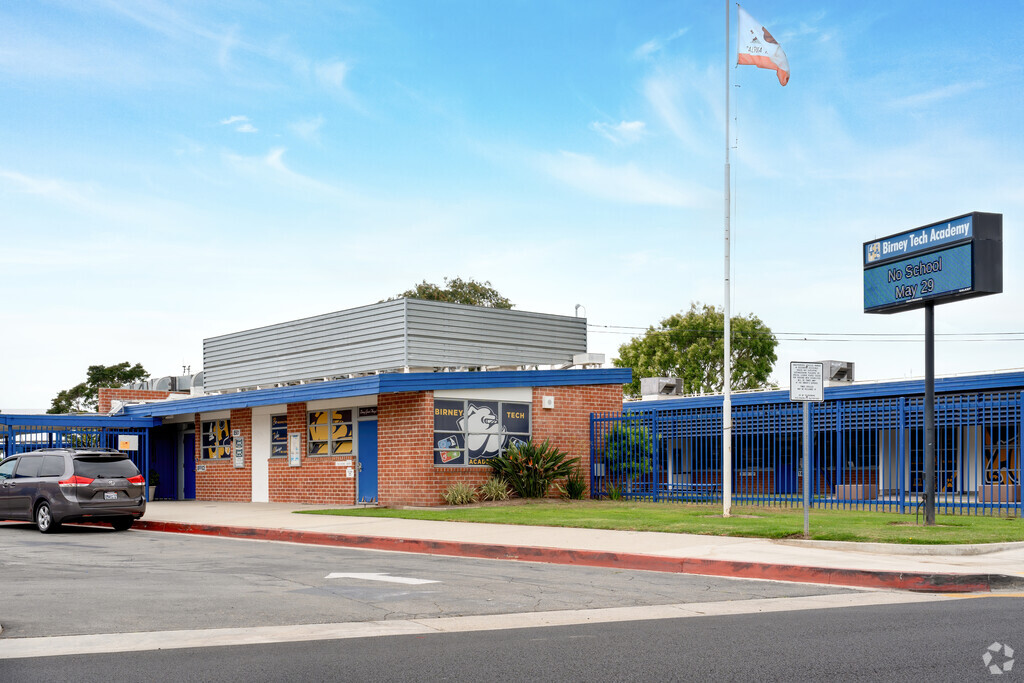A large sign stands in front of the entrance to Binary Tech Academy in the city of Pico Rivera.