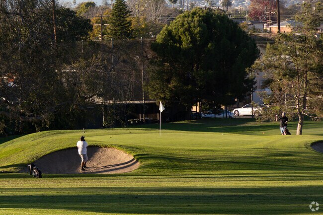 Golfers enjoy sand traps and fairways at Maggie Hathaway Golf Course in Manchester Square.