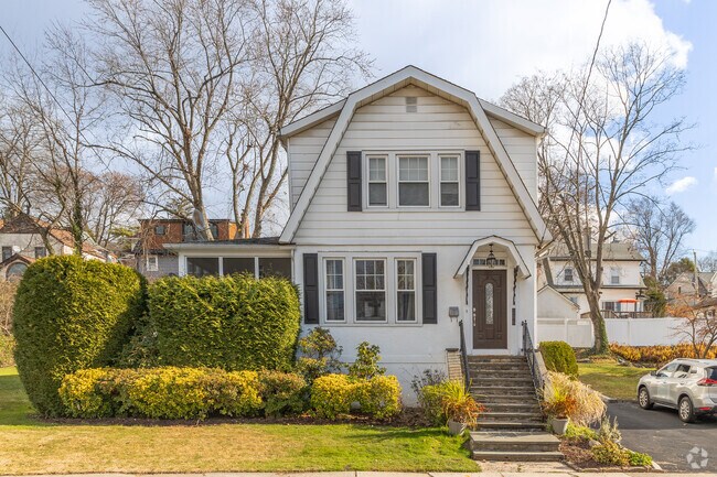 A Dutch Colonial-inspired home by Benedict Ave in Tuckahoe, NY.