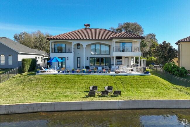 This Mediterranean style home, in Wekiva Springs, is located off of Sand Lake Road.