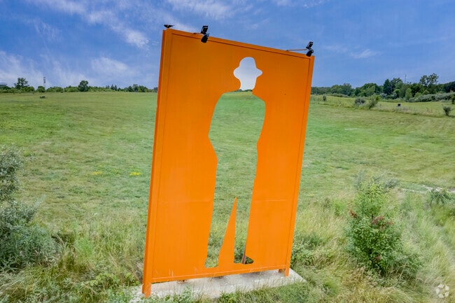 Mephisto stands on a hilltop overlooking Lyon Township.