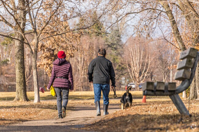 A couple enjoying a walk with the dog in the Diamond Lake neighborhood.