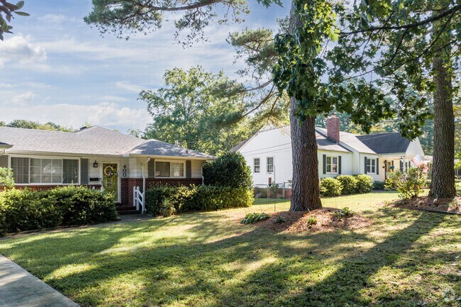 Ranch-style homes in the Suburban Acres neighborhood typically have spacious front yards.