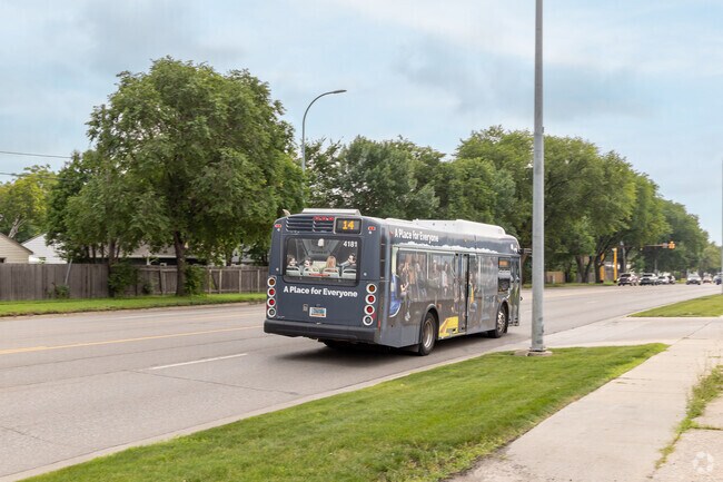 The closest bus stop to the neighborhood is near Walmart, across the freeway.