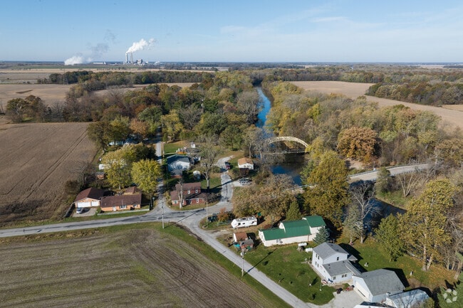 Homes in Kankakee are surrounded by lush trees and farmland near the river.