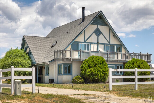 Traditional Home with an A Frame Roof Seen in Lake Riverside