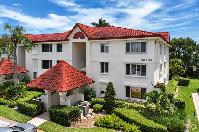 Three story condominium complex in Hypoluxo neighborhood.
