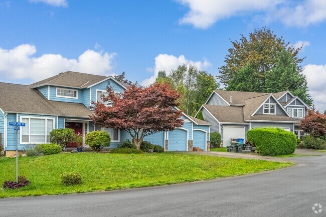 A row of colorful homes in a North East Olympia street.