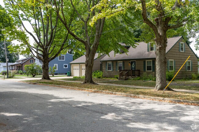 The streets of Downtown Oswego are lined with mature trees that provide shade from summer heat.