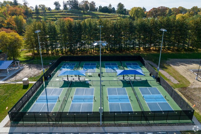 Enjoy a game of pickleball at Park Hill's Riverside Park.