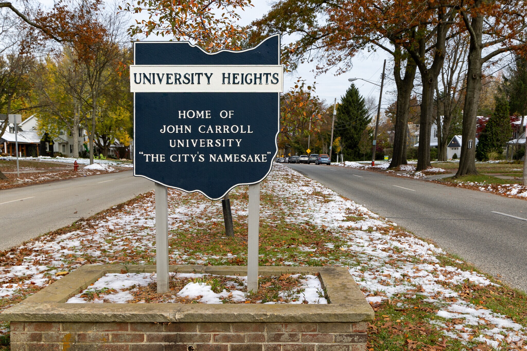 A sign at the entrance of University Heights welcomes residents and new visitors.