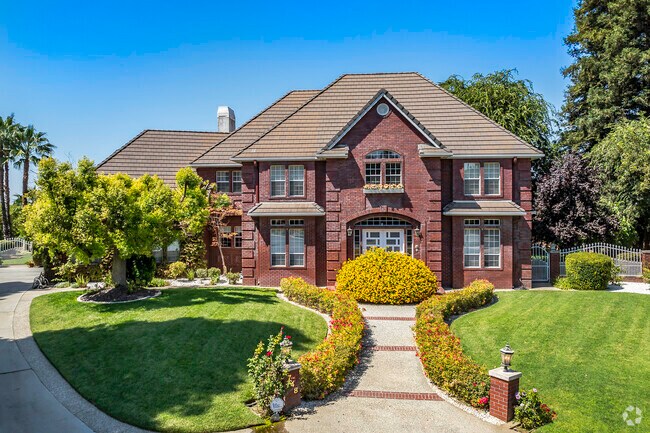 This all-brick custom home has 2-stories and sits on a larger lot in Yuba City.