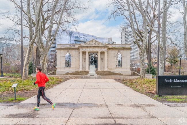 Joggers run by world famous museums in Logan Square.