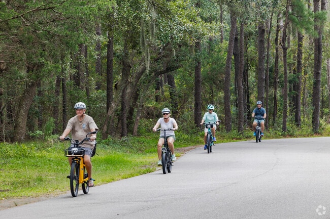 Huntington Beach State Park offers bike-friendly coastal trails near Litchfield Beach.