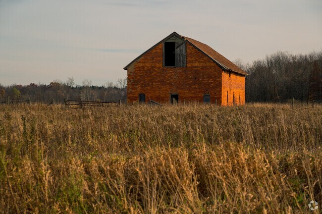 An idyllic old brick barn sits in a field in Burlington Township.