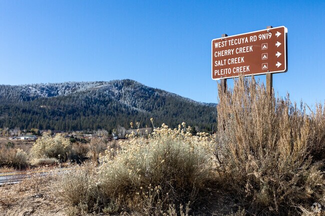 Trail sign pointing the way to multiple trailheads in Lake of the Woods.