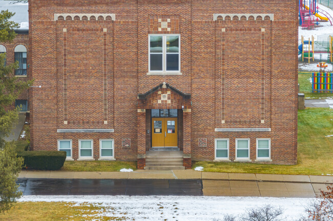 A looping drive goes past the entrance of St John Vianney Catholic School for pickups.