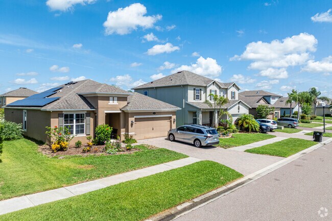 A row of modern, family-friendly homes in Long Lake Ranch, where nature and community meet.
