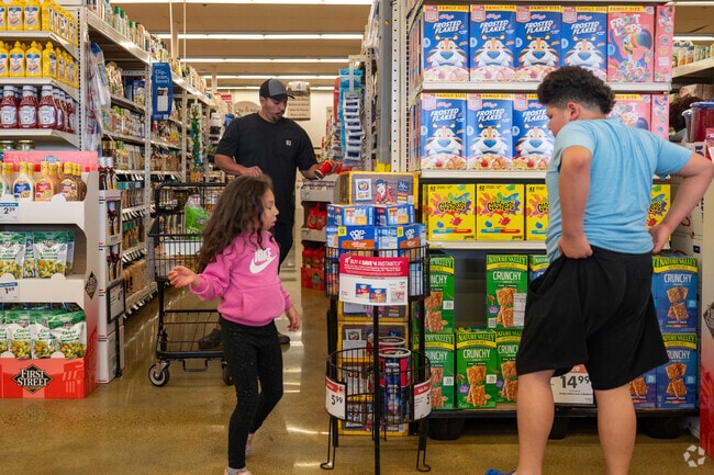 Buy some snacks with your kids at Willowbrook grocery store.