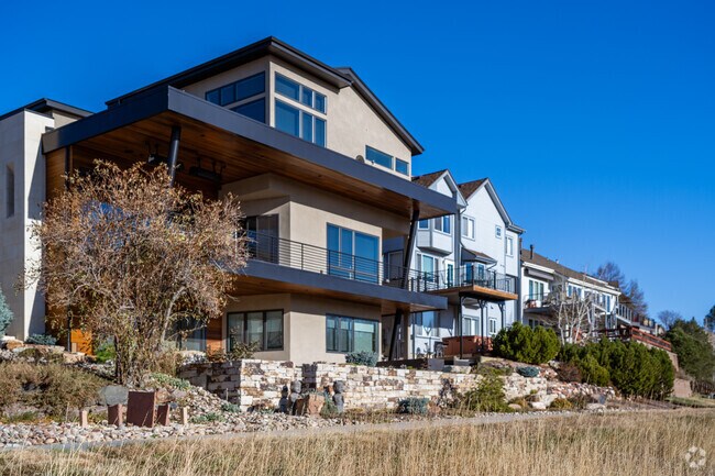 Modern homes at The Outlook have views of the Rocky Mountains near the Ruth Roberts Open Space.
