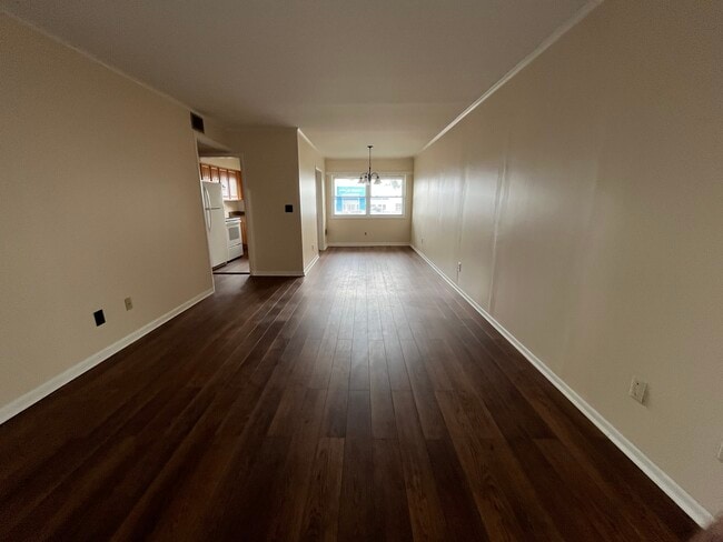Living room/Dining combo facing towards back of apartment