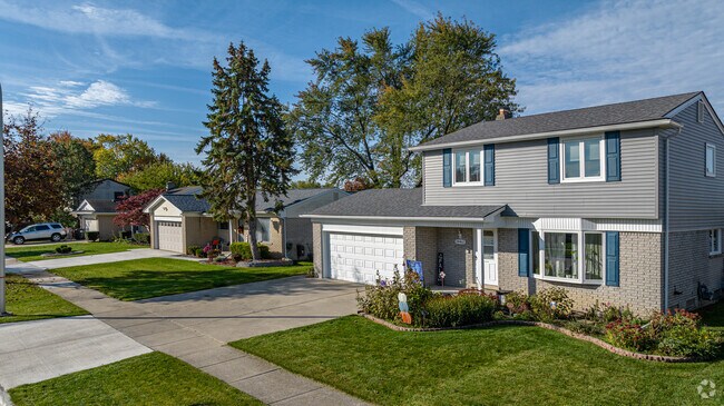 Colonial Revival homes sit next to smaller ranch-style homes throughout Woodhaven.