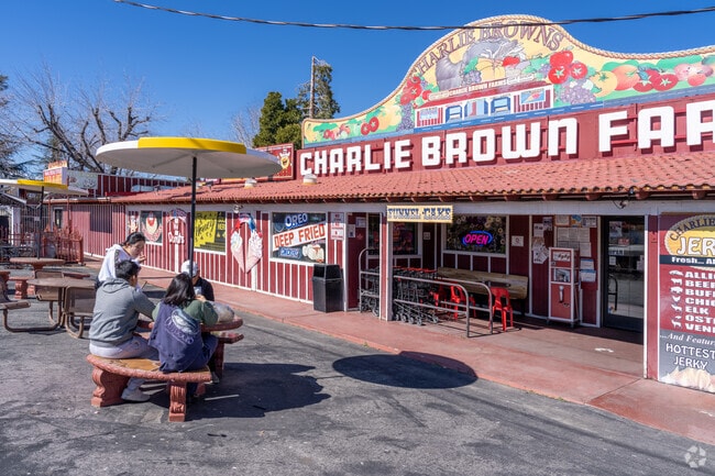 A family has their lunch outside in front of Charlie Brown Farms in Littlerock.
