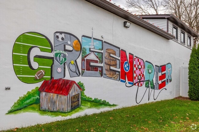 The Greenbrier mural shows off the local life of football, church, and railroads.