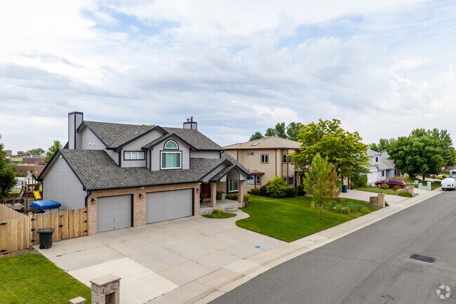 New bilevel homes with three car garages in Arvada Plaza Area in Arvada, Colorado.