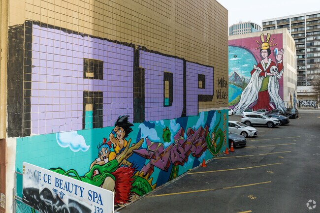 View of murals lining the walls of  Chinatown located in Oakland, CA.