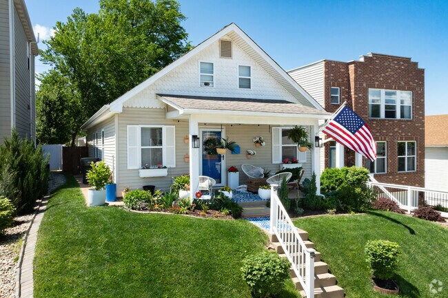 This well maintained bungalow proudly displays the American flag in the Franz Park neighborhood.
