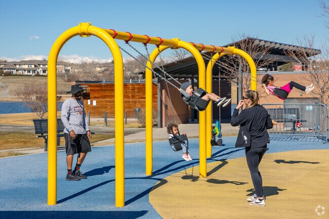 Kids love swinging on the swing sets at Margaret Carpenter Park near Woodglen.
