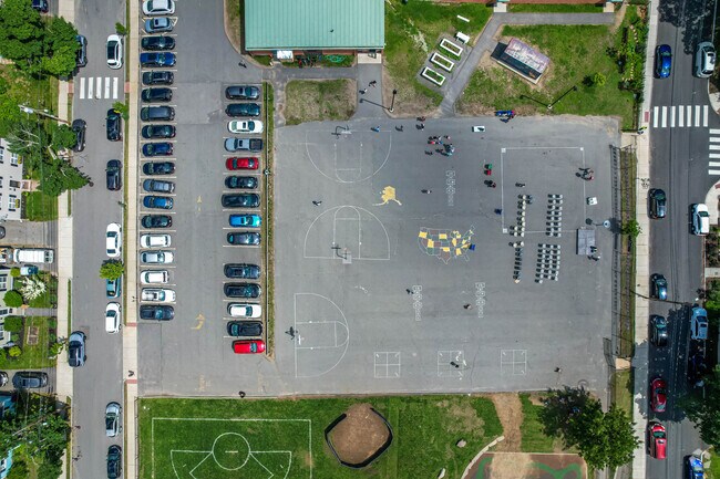 M. Norcross Stratton Elementary School parking lot and play area overview in Arlington.