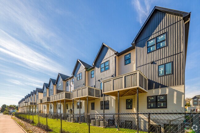 The new condos provide a delightful small patio that offers picturesque views of manicured hills