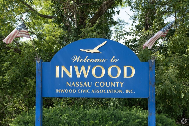 Signage posted at the Inwood, New York city limit welcomes you.