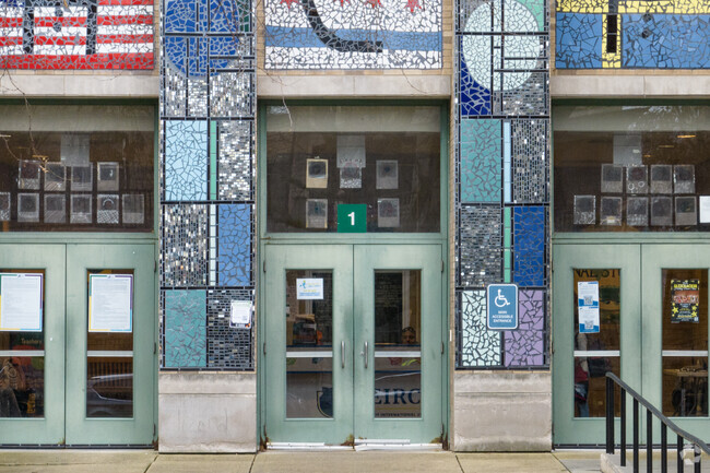 Mosaics decorate the columns of The Pierce School of International Studies .