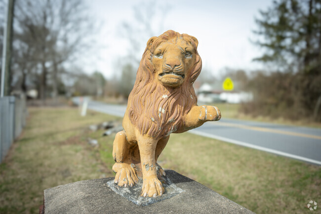 Sculptures representing the Etowah Lions Club can be found throughout the area.