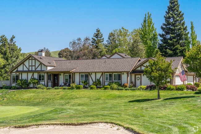 This home lies on the edge of the golf course with views of the putting green.