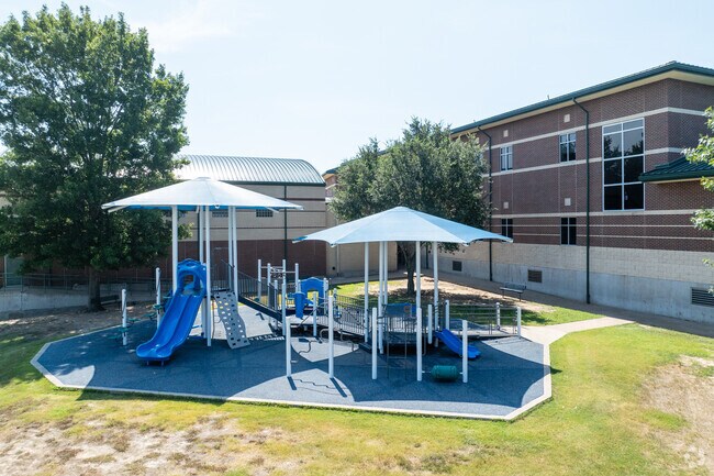 Shady trees and play areas at Seguin Elementary offer students a great place to enjoy recess.