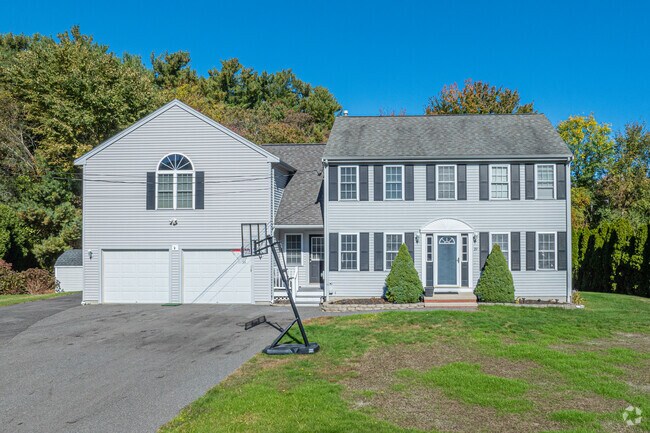 Contemporary colonials feature multi-car garages and large property parcels in City Center.