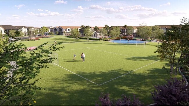 Aerial view of the soccer field, surrounded by shady trees