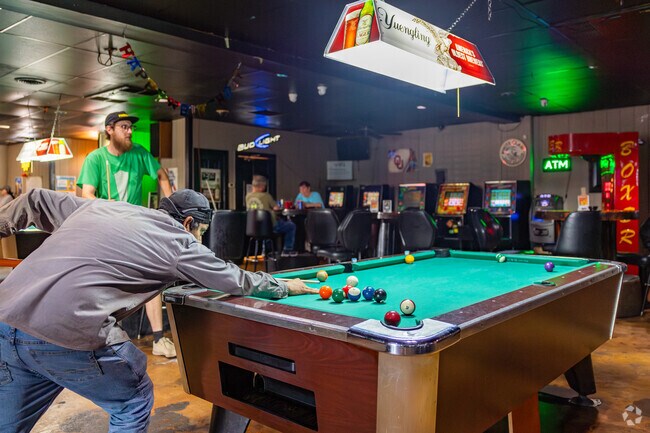 Pool is a popular past time at the Friendly Tavern in Park Plaza East.