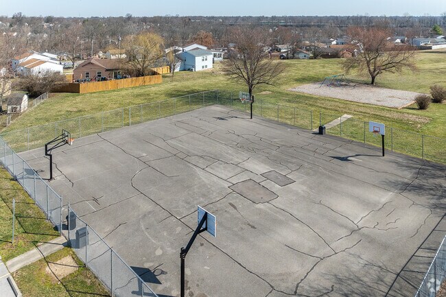 Covered Bridge Park in Elsmere features a playground, basketball court, walking path, and is considered good for kids, with wheelchair accessible parking and slides.